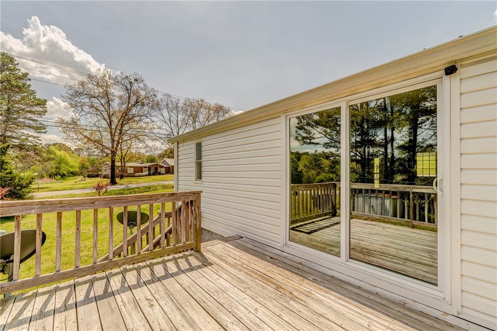 109 Webb Drive Northeast Calhoun, GA 30701 - Photo 17 of 49 a view of a wooden deck with a yard