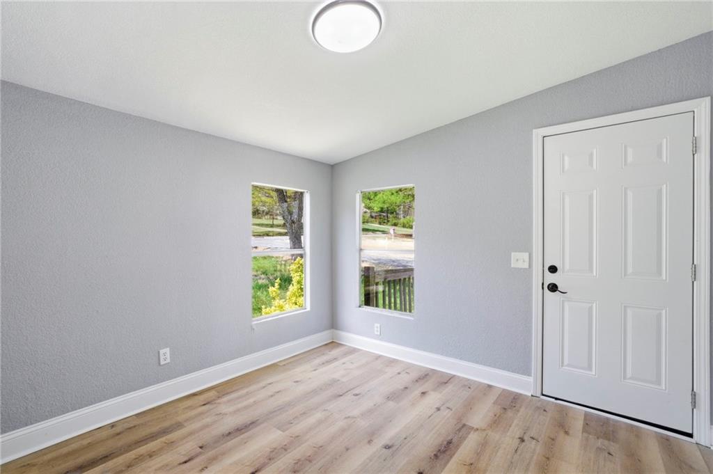 109 Webb Drive Northeast Calhoun, GA 30701 - Photo 19 of 49 wooden floor in an empty room with a window
