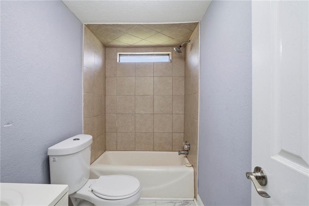 109 Webb Drive Northeast Calhoun, GA 30701 - Photo 22 of 49 a white toilet sitting next to a bath tub