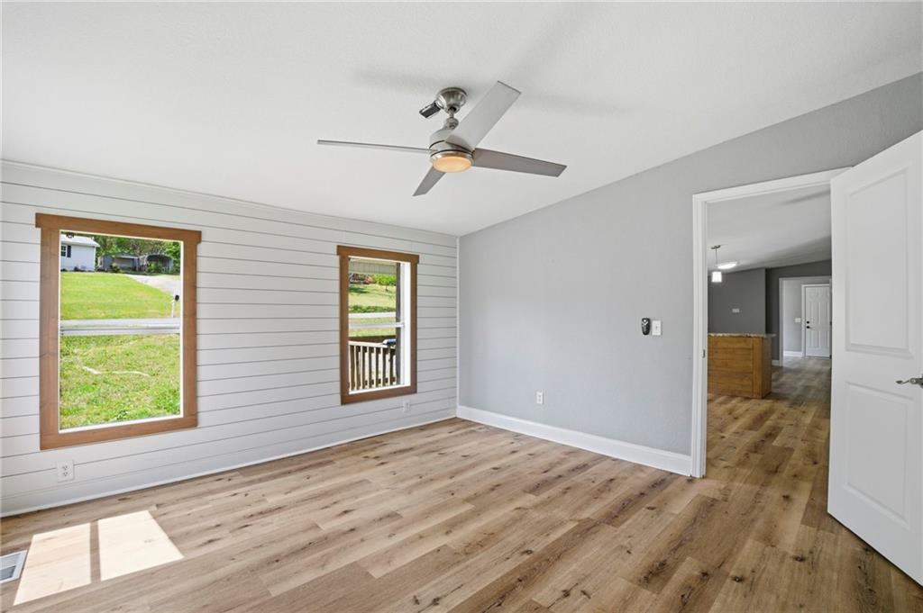 109 Webb Drive Northeast Calhoun, GA 30701 - Photo 26 of 49 wooden floor in an empty room with a window