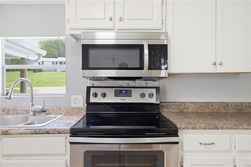 109 Webb Drive Northeast Calhoun, GA 30701 - Photo 34 of 49 a stove top oven sitting inside of a kitchen