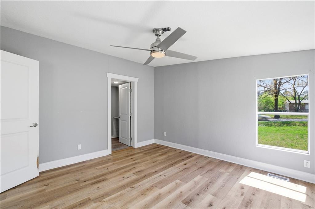 109 Webb Drive Northeast Calhoun, GA 30701 - Photo 41 of 49 a view of an empty room with wooden floor and a window