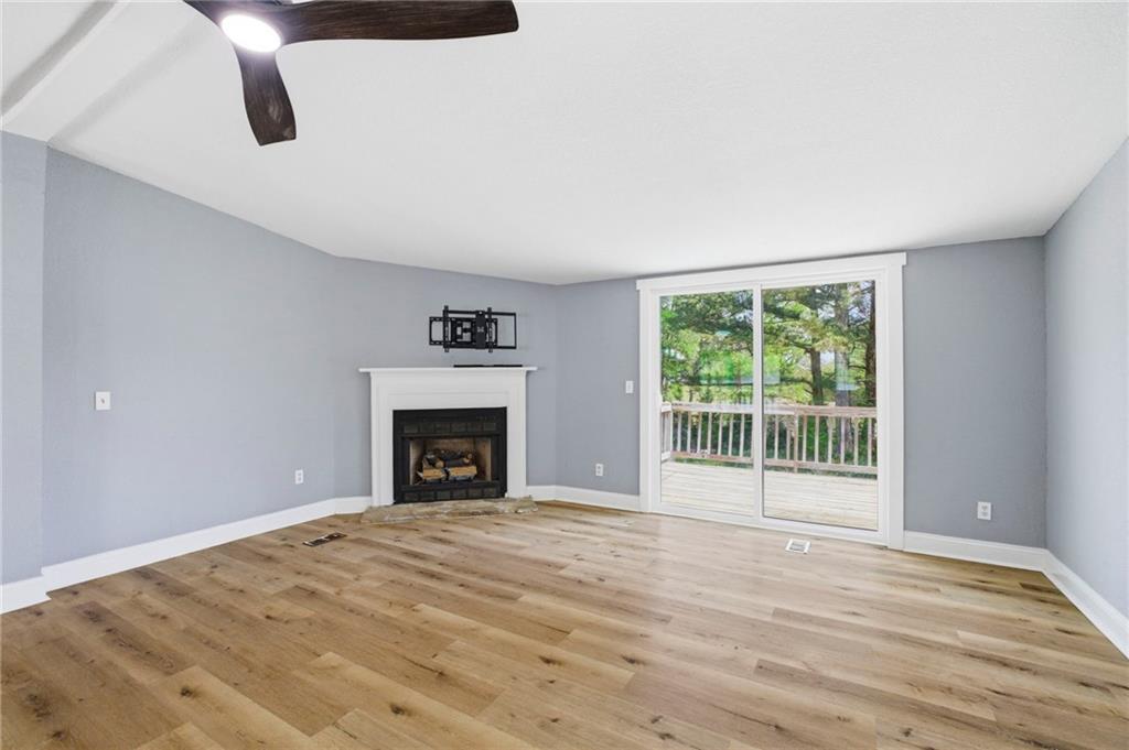 109 Webb Drive Northeast Calhoun, GA 30701 - Photo 42 of 49 a view of an empty room with window and wooden floor
