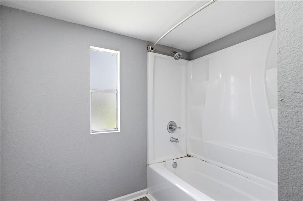 109 Webb Drive Northeast Calhoun, GA 30701 - Photo 45 of 49 a bathroom with a bathtub and a shower