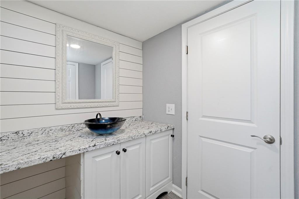 109 Webb Drive Northeast Calhoun, GA 30701 - Photo 48 of 49 a bathroom with a granite countertop sink and a mirror