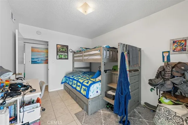 a bedroom with furniture and a bed