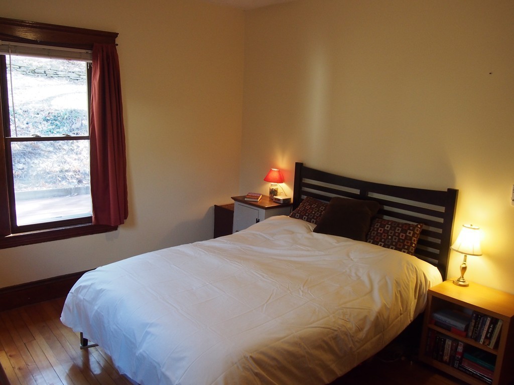 78 Beaconsfield Road Worcester, MA 01602 - Photo 15 of 30 a bedroom with a bed and window