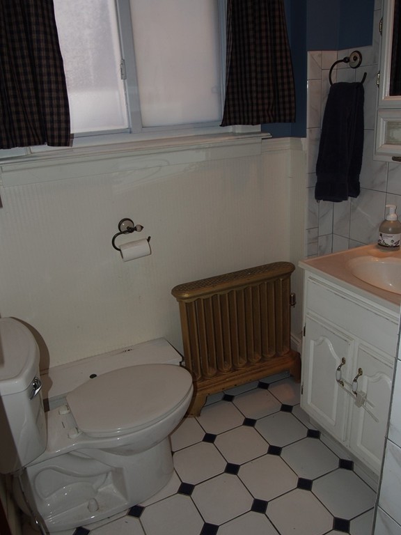 78 Beaconsfield Road Worcester, MA 01602 - Photo 18 of 30 a bathroom with a sink a toilet and a mirror