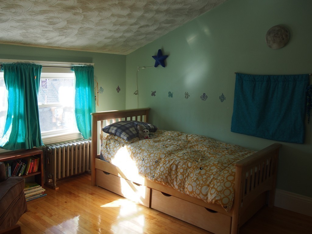 78 Beaconsfield Road Worcester, MA 01602 - Photo 19 of 30 a bed sitting in a bedroom next to a window