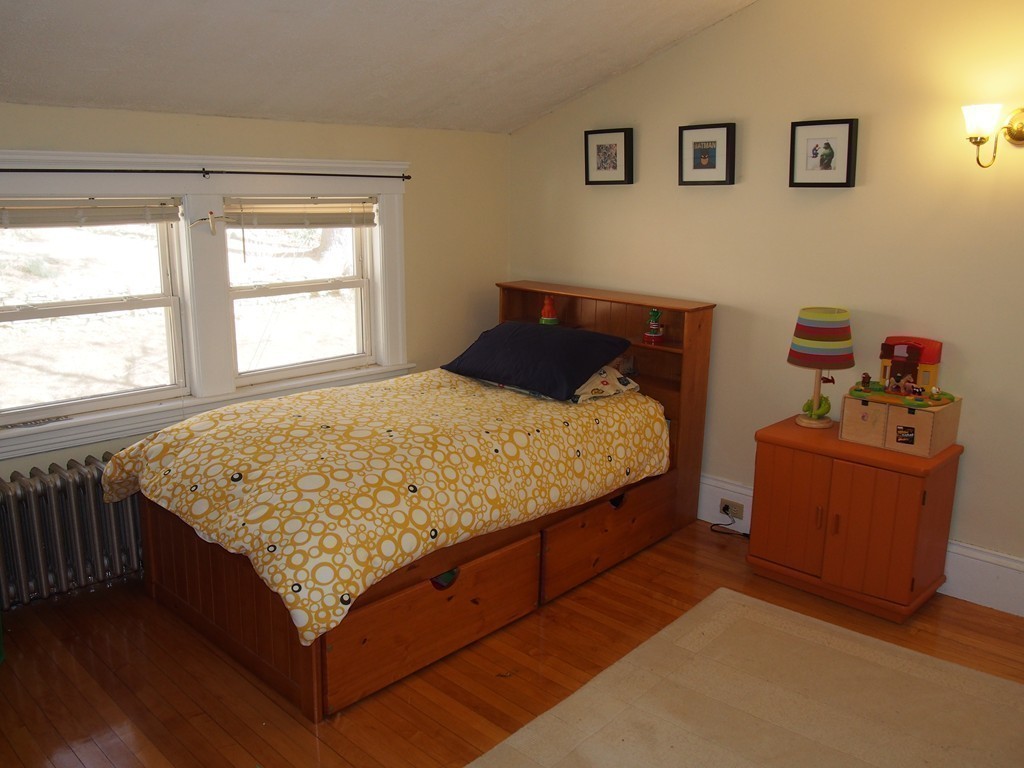 78 Beaconsfield Road Worcester, MA 01602 - Photo 21 of 30 a bed sitting in a bedroom next to a window