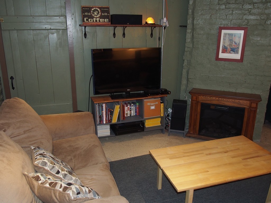 78 Beaconsfield Road Worcester, MA 01602 - Photo 23 of 30 a living room with furniture and a flat screen tv