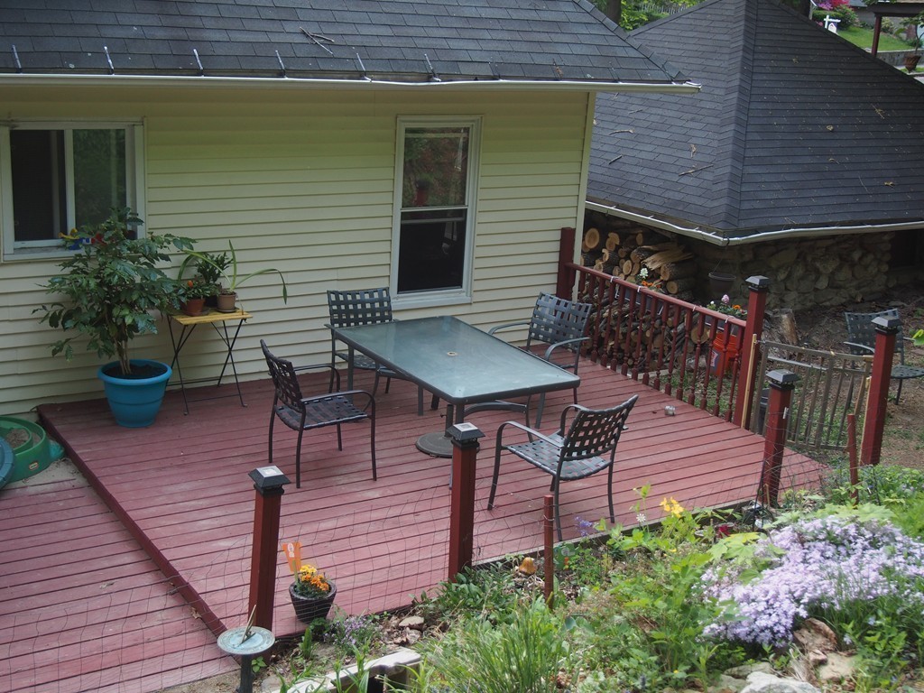 78 Beaconsfield Road Worcester, MA 01602 - Photo 26 of 30 a view of a patio with table and chairs with wooden floor and plants