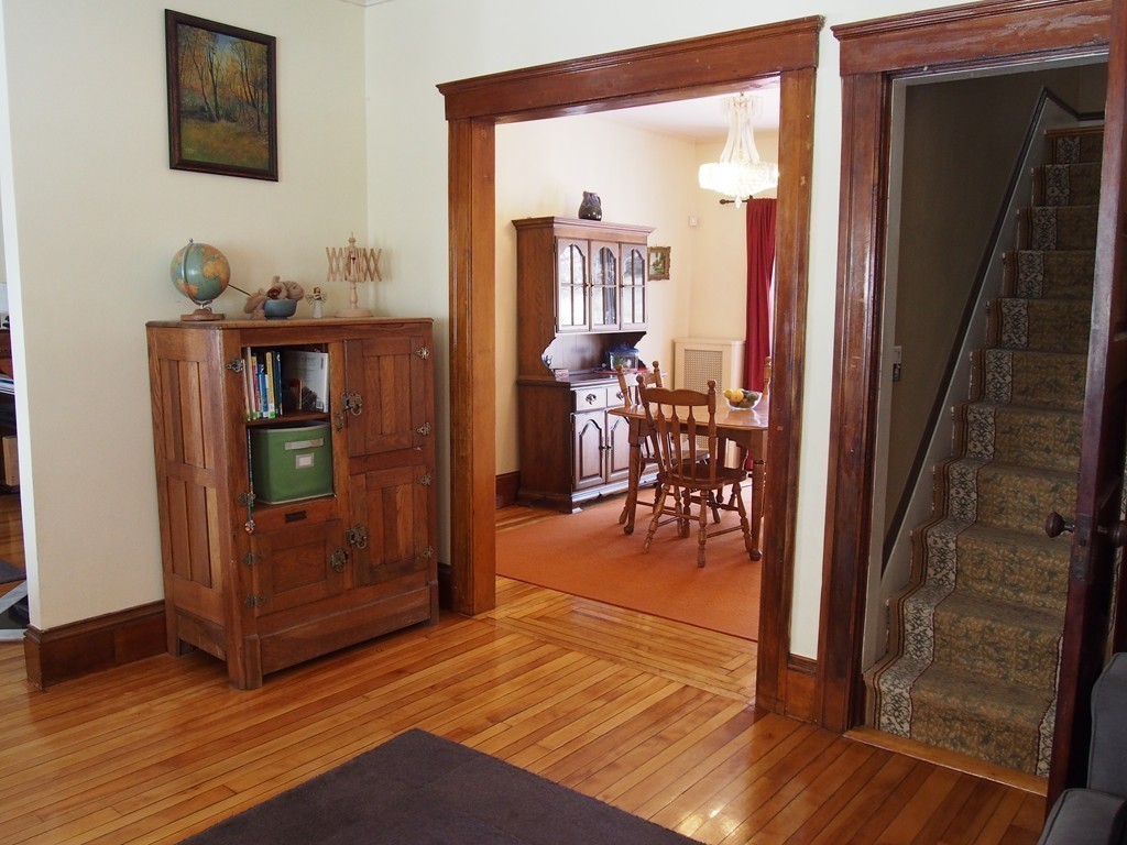 78 Beaconsfield Road Worcester, MA 01602 - Photo 7 of 30 a view of a hallway and a livingroom with furniture