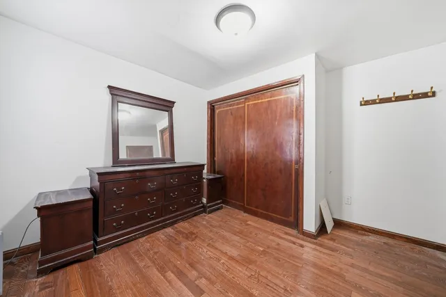 a room with a dresser and a mirror