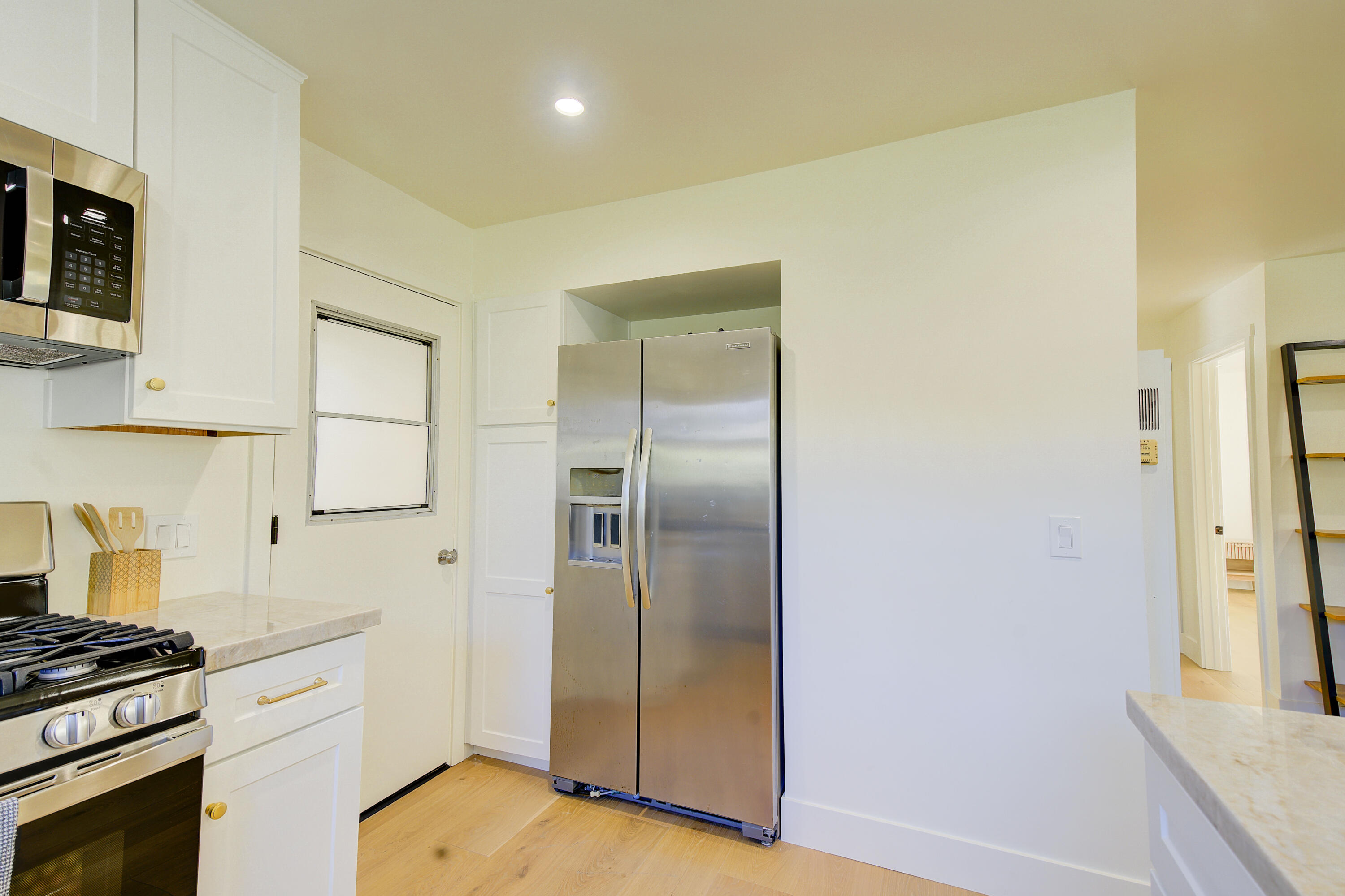 2022 Monterey Street Santa Barbara, CA 93101 - Photo 15 of 24 a kitchen with stainless steel appliances a refrigerator and a stove top oven