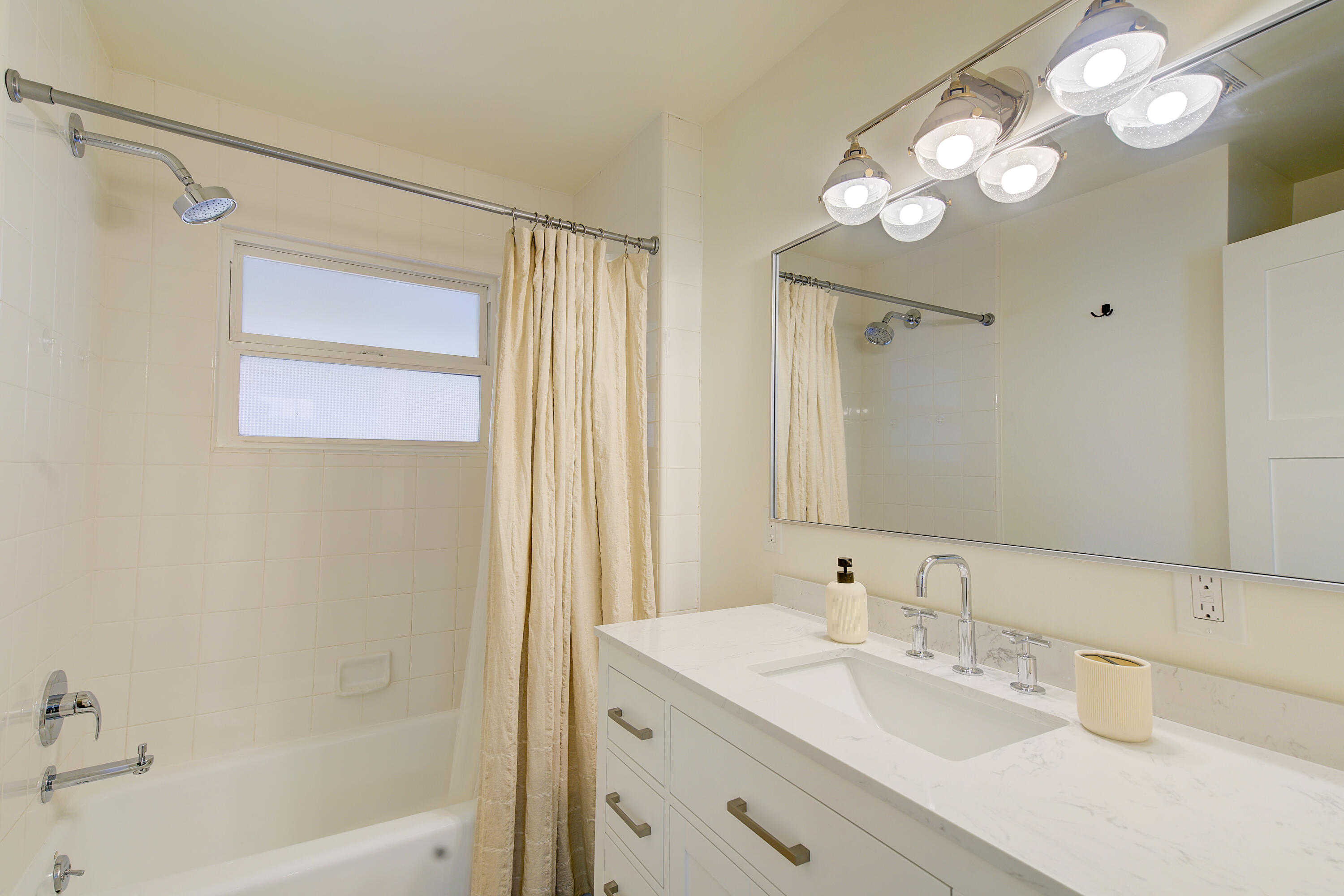 2022 Monterey Street Santa Barbara, CA 93101 - Photo 16 of 24 a bathroom with a tub a sink and a mirror