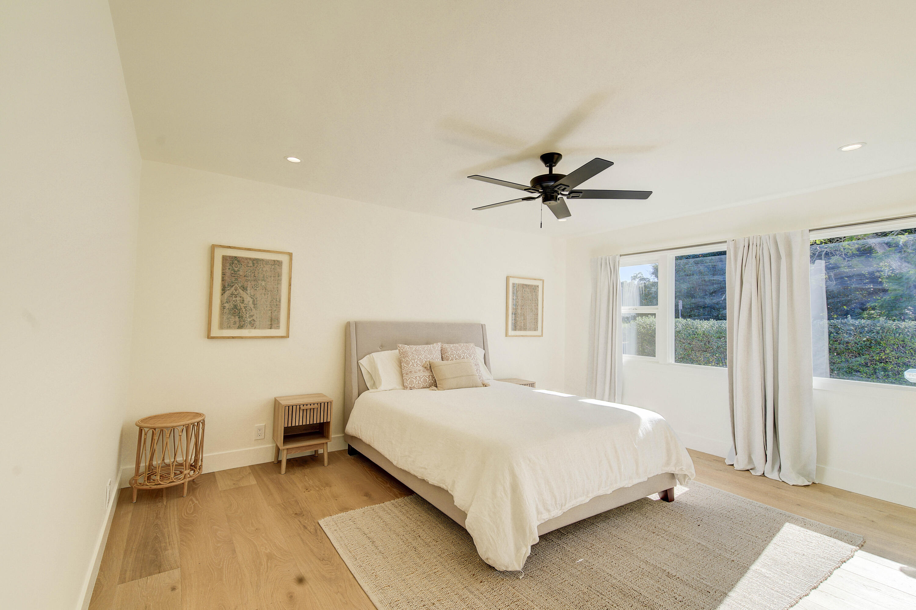 2022 Monterey Street Santa Barbara, CA 93101 - Photo 18 of 24 a bedroom with a bed and a chandelier