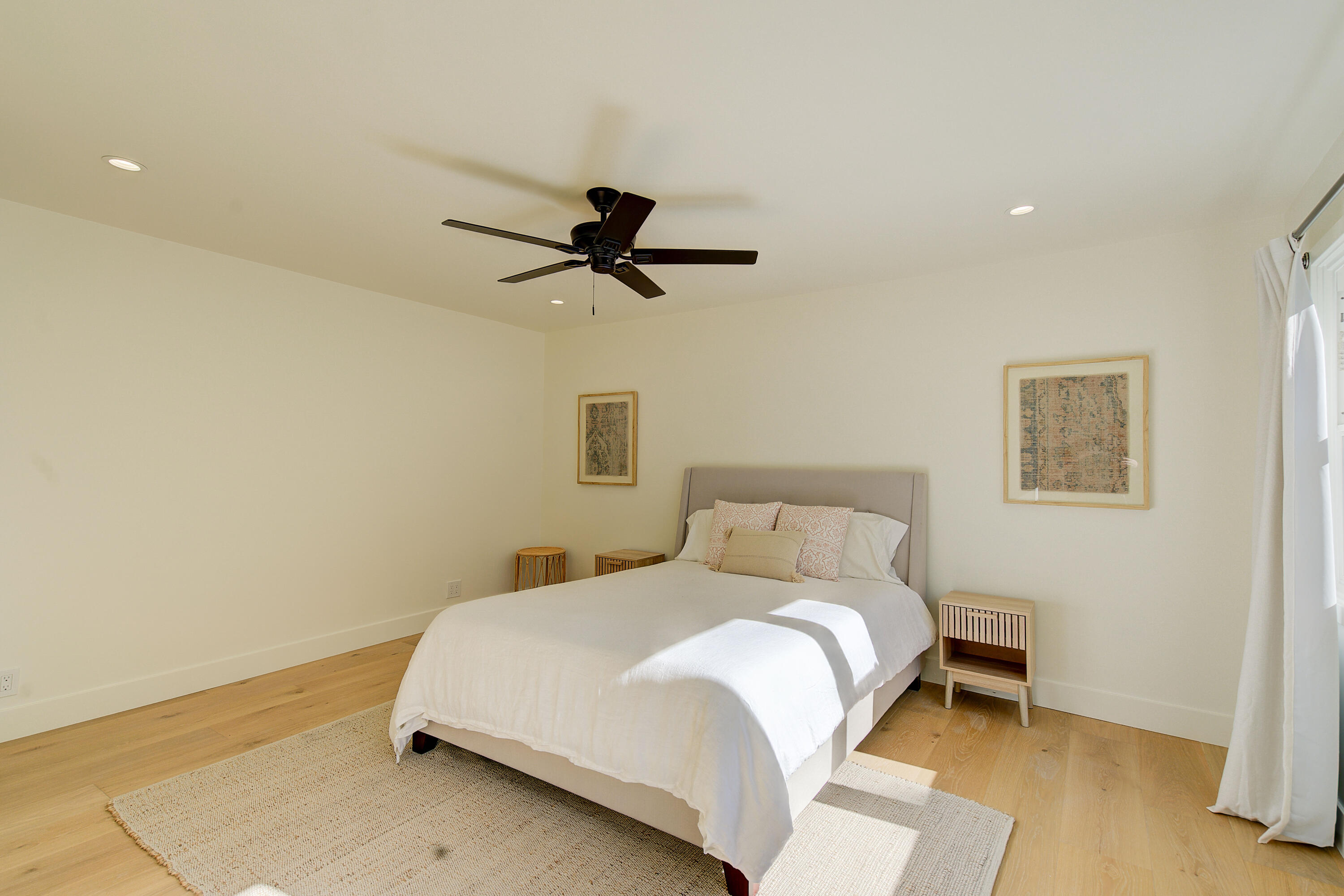 2022 Monterey Street Santa Barbara, CA 93101 - Photo 19 of 24 a bedroom with a bed and a ceiling fan