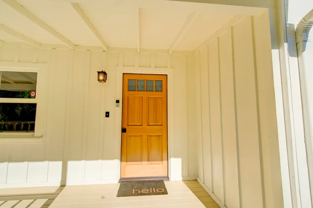 a bathroom with a glass door shower