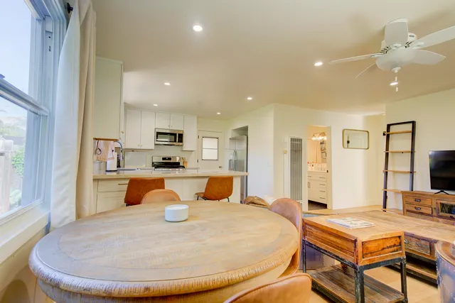 a living room with furniture and flat screen tv