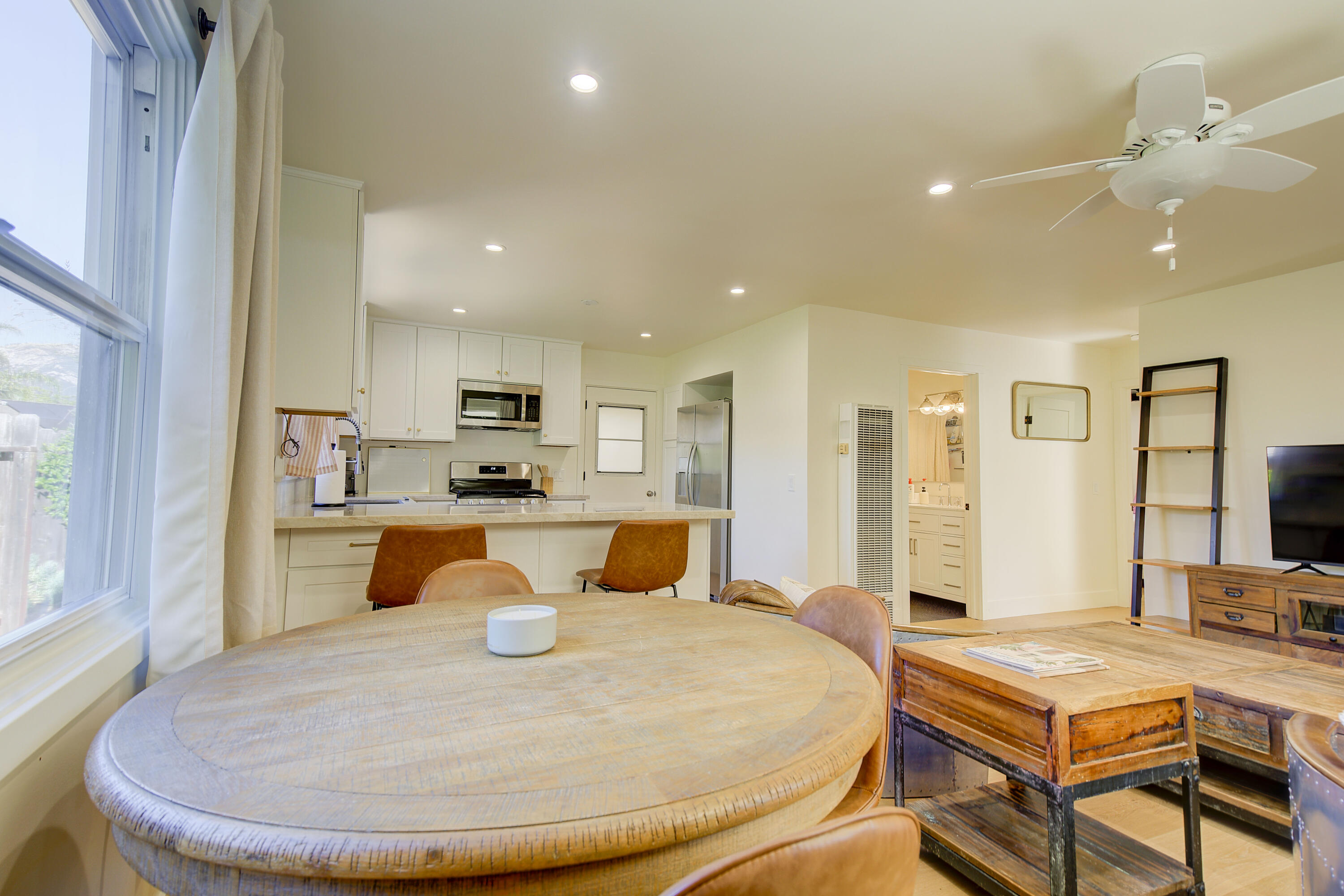 2022 Monterey Street Santa Barbara, CA 93101 - Photo 10 of 24 a large white kitchen with sink and a refrigerator