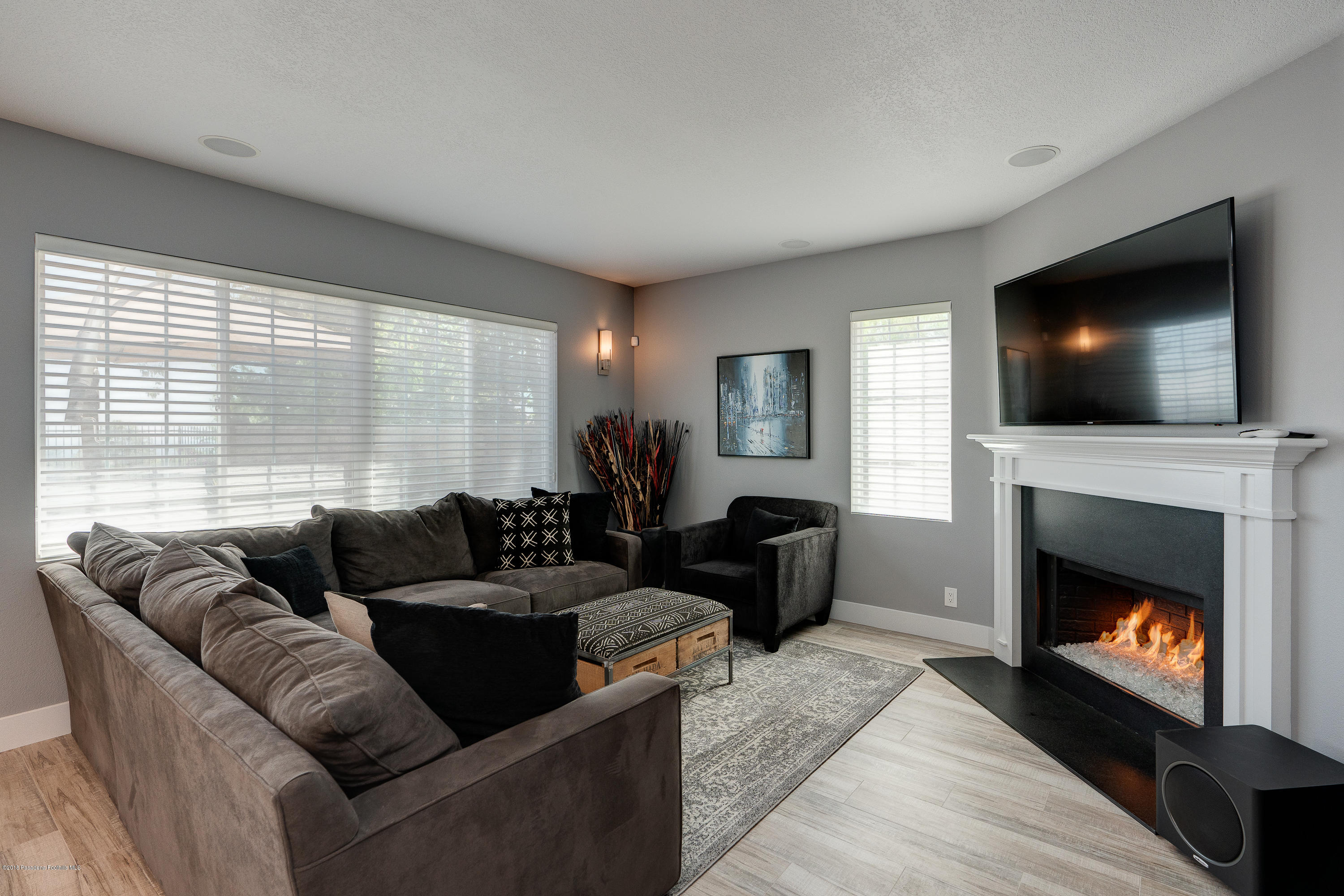 3503 Giddings Ranch Road Altadena, CA 91001 - Photo 19 of 75 a living room with furniture a flat screen tv and a fireplace