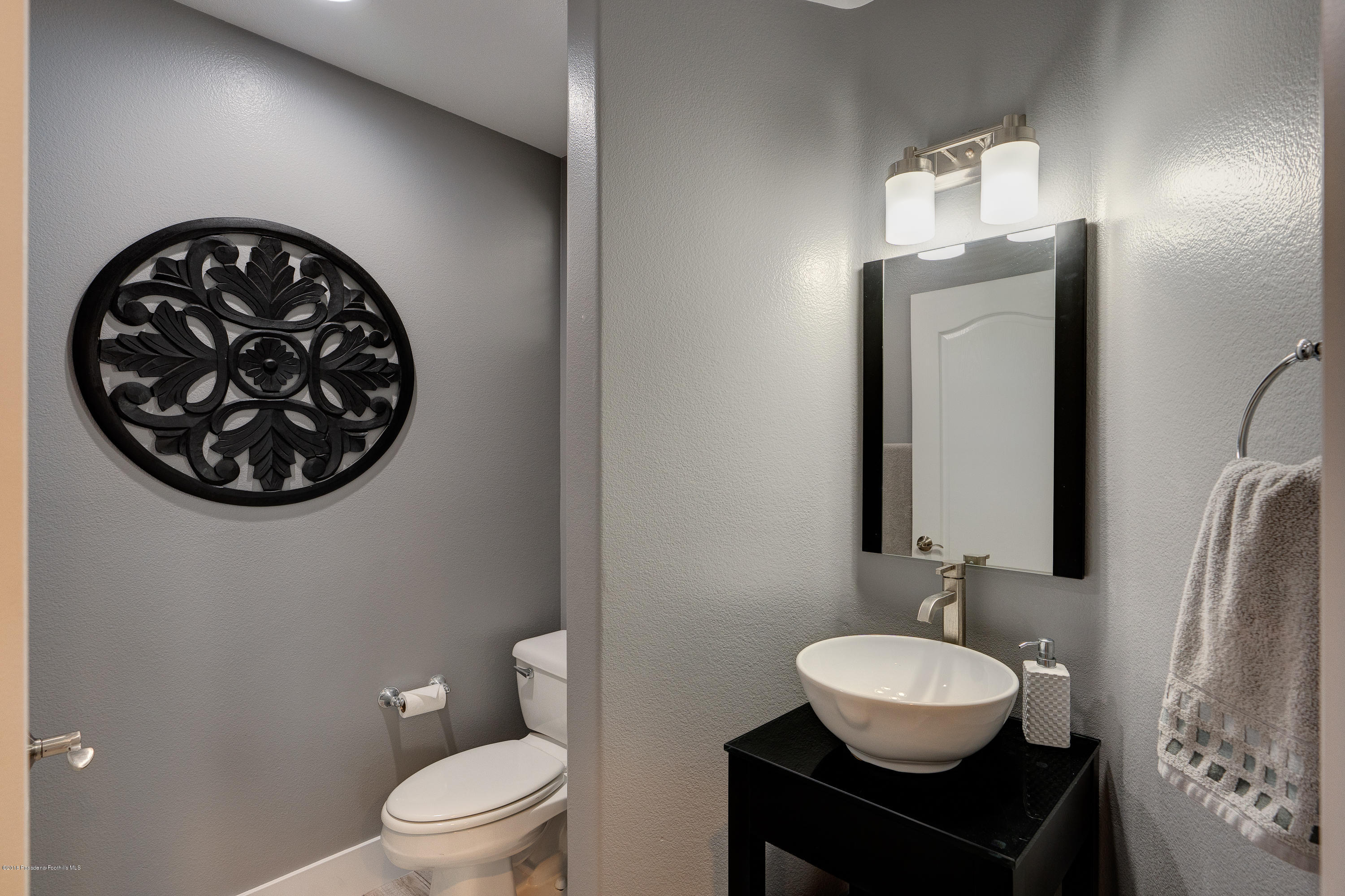 3503 Giddings Ranch Road Altadena, CA 91001 - Photo 21 of 75 a bathroom with a toilet a sink and a mirror