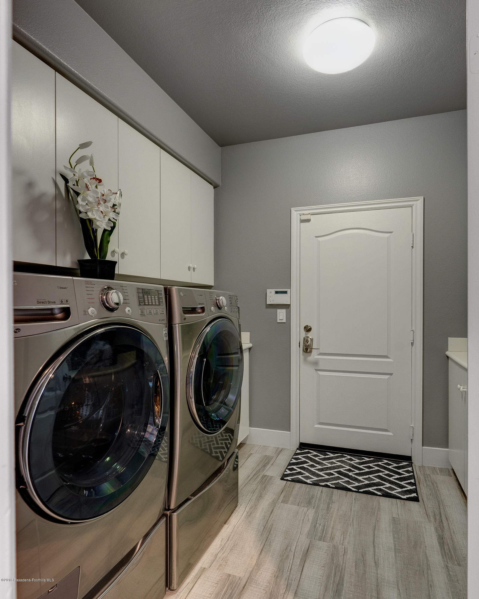 3503 Giddings Ranch Road Altadena, CA 91001 - Photo 25 of 75 a view of a storage and utility room with washer and dryer