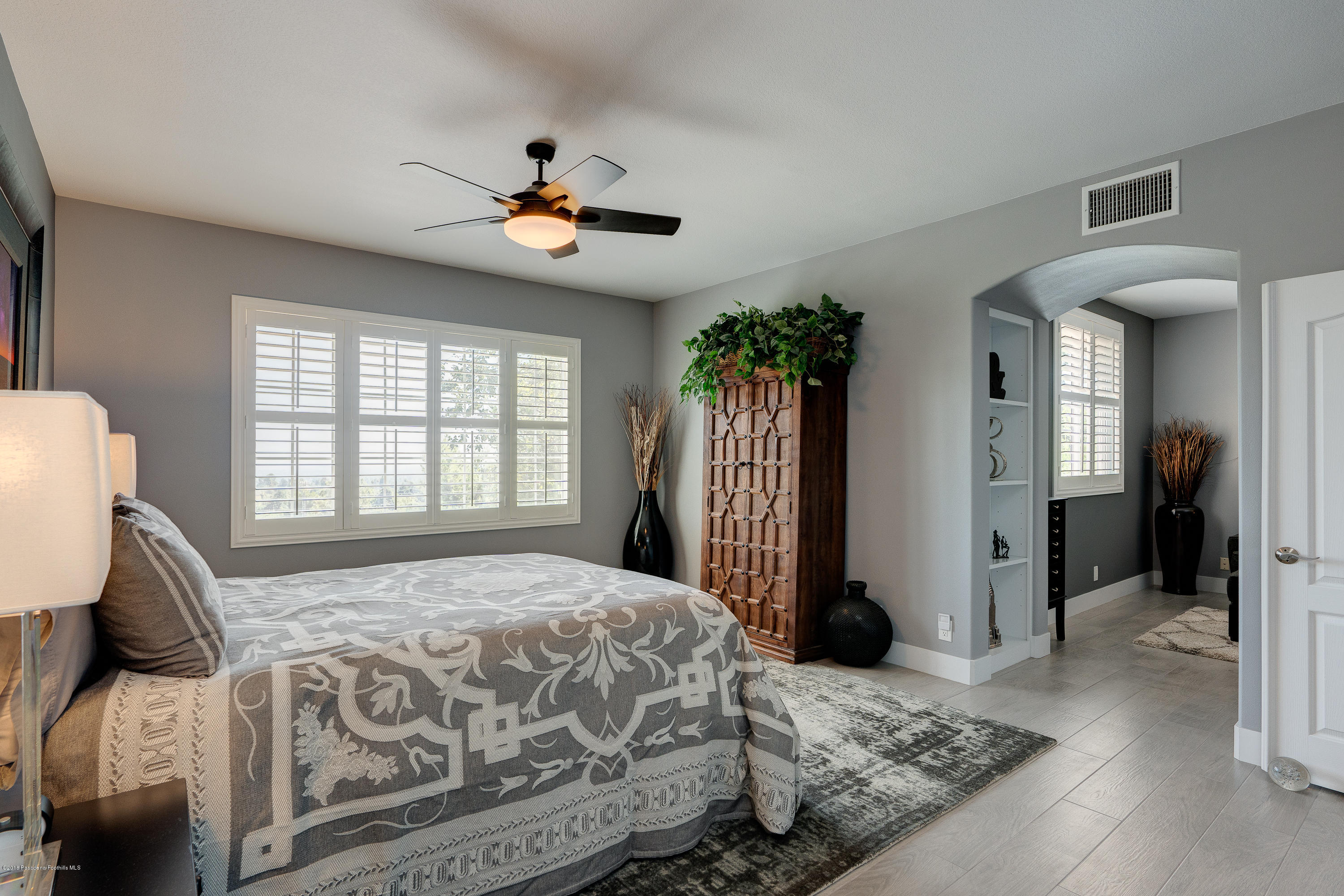 3503 Giddings Ranch Road Altadena, CA 91001 - Photo 30 of 75 a bedroom with a large bed and a chandelier