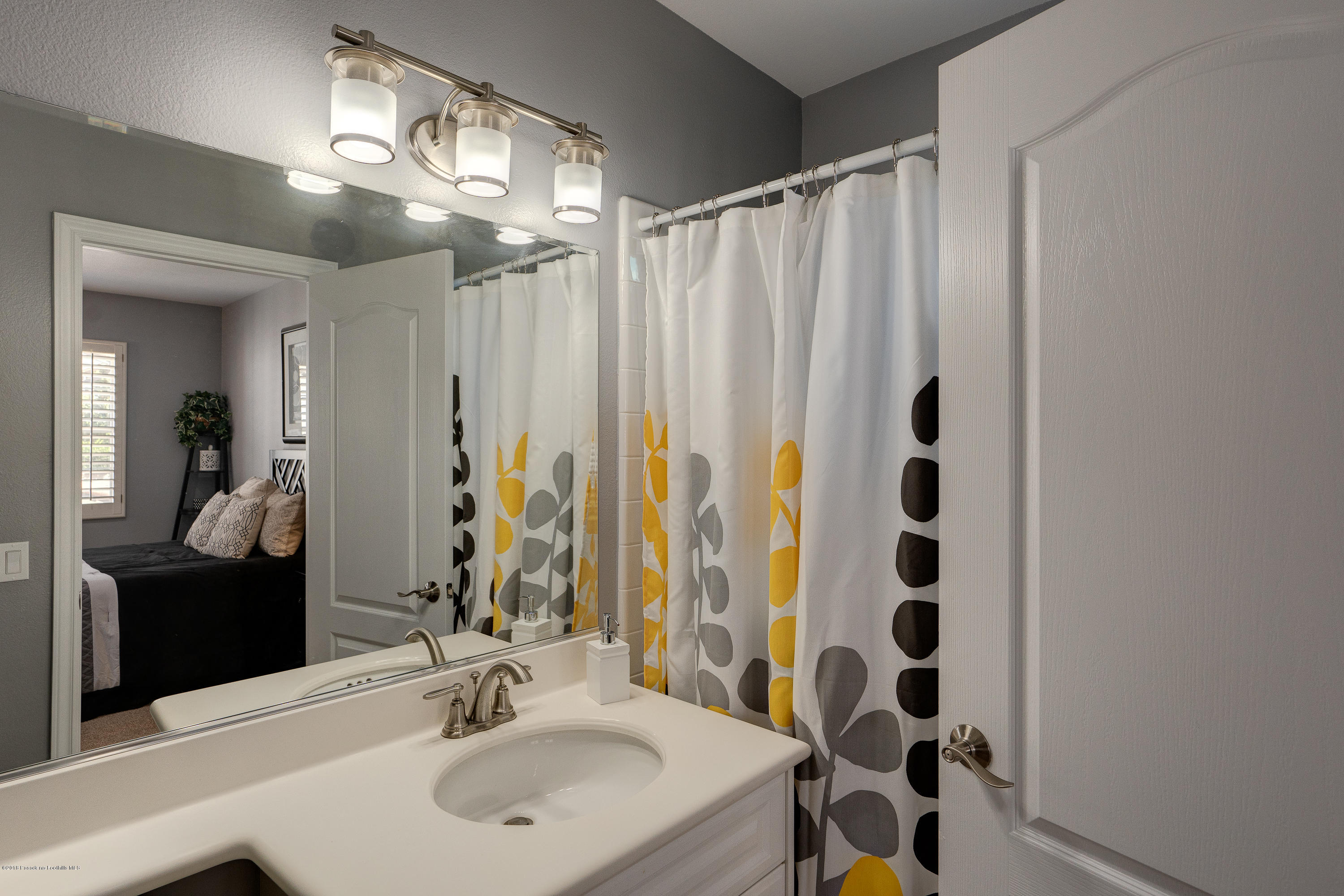 3503 Giddings Ranch Road Altadena, CA 91001 - Photo 40 of 75 a bathroom with a sink a mirror a vanity and a shower