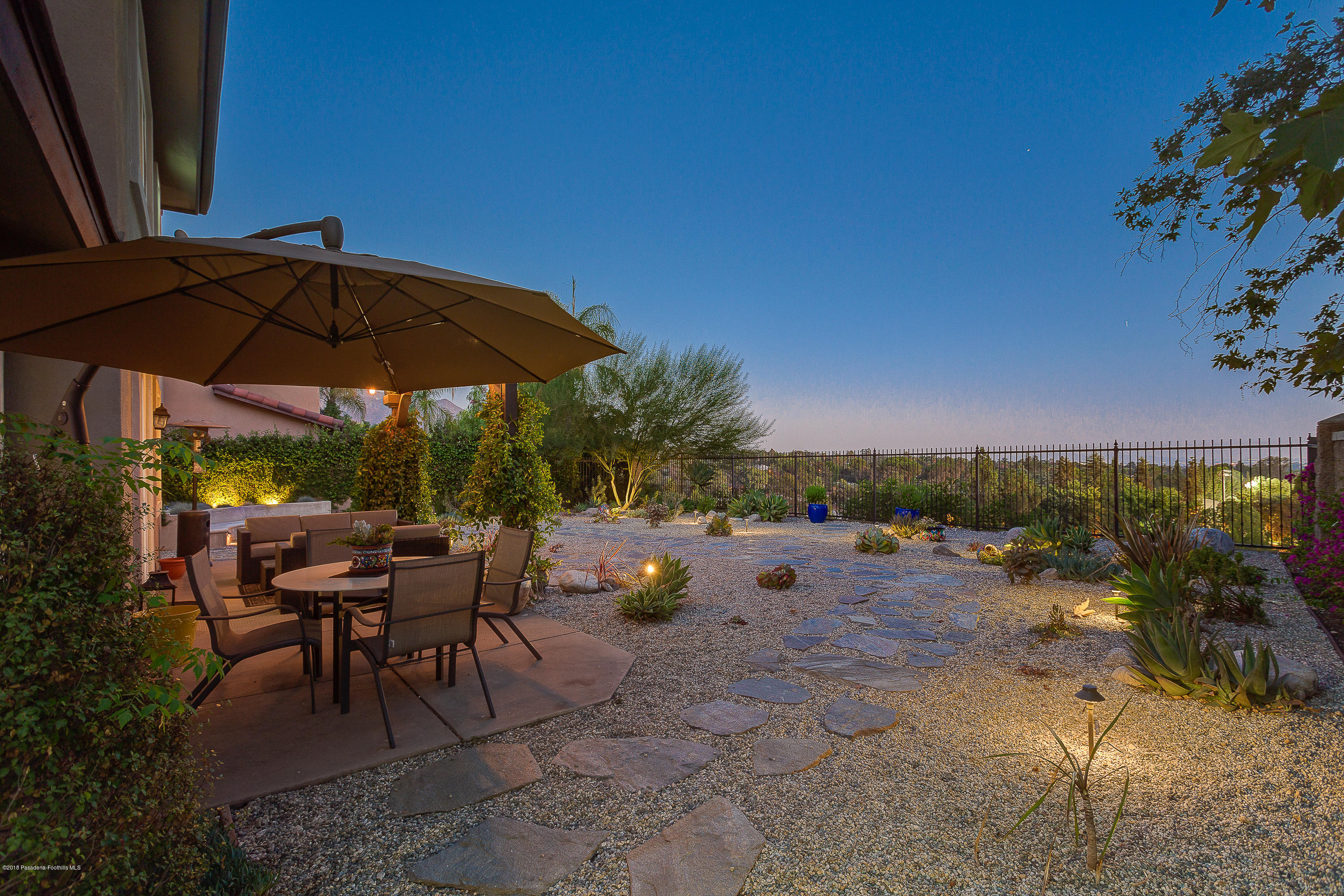 3503 Giddings Ranch Road Altadena, CA 91001 - Photo 48 of 75 a view of a tables and chairs under an umbrella in patio