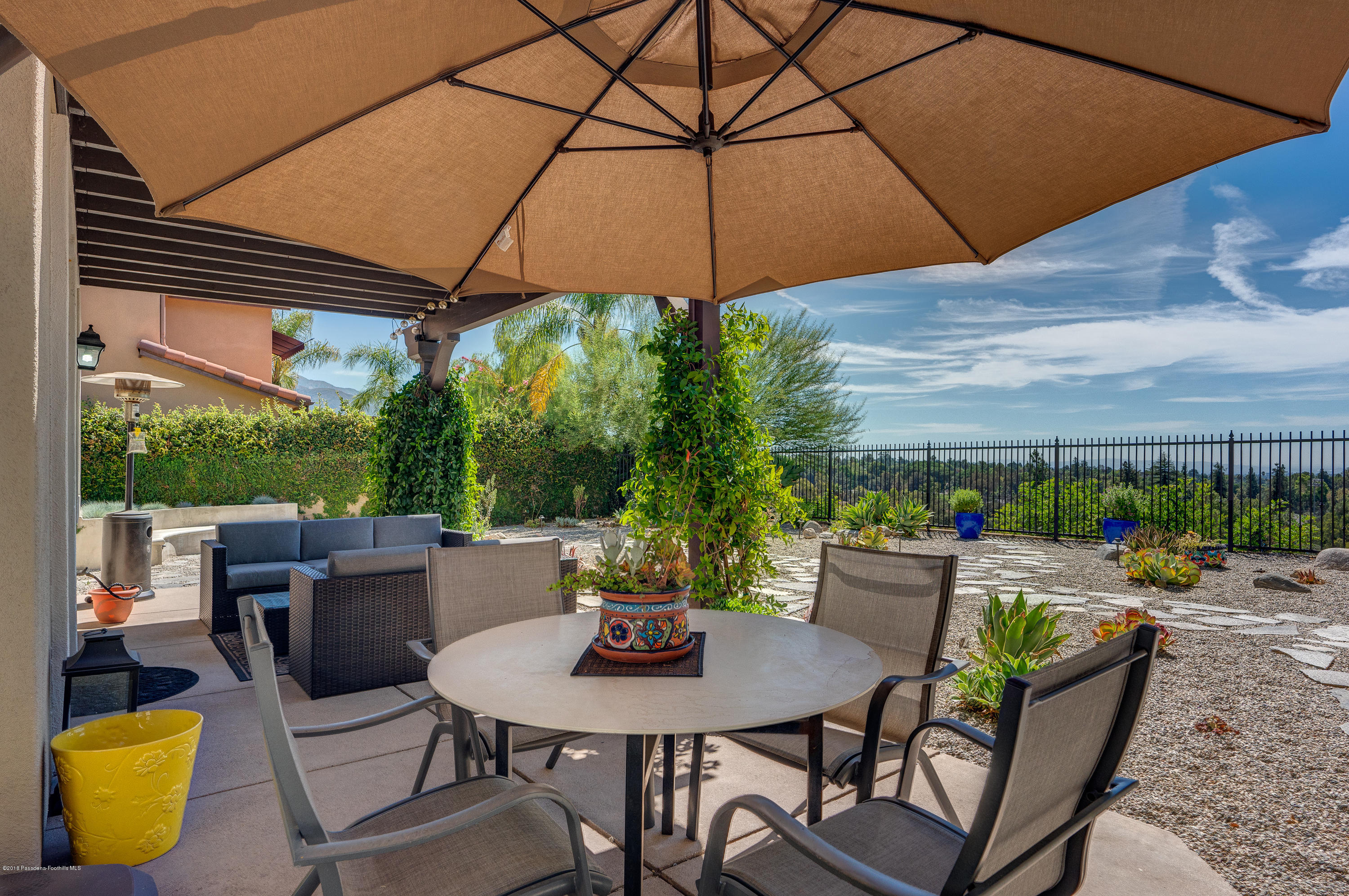 3503 Giddings Ranch Road Altadena, CA 91001 - Photo 50 of 75 a backyard of a house with table and chairs