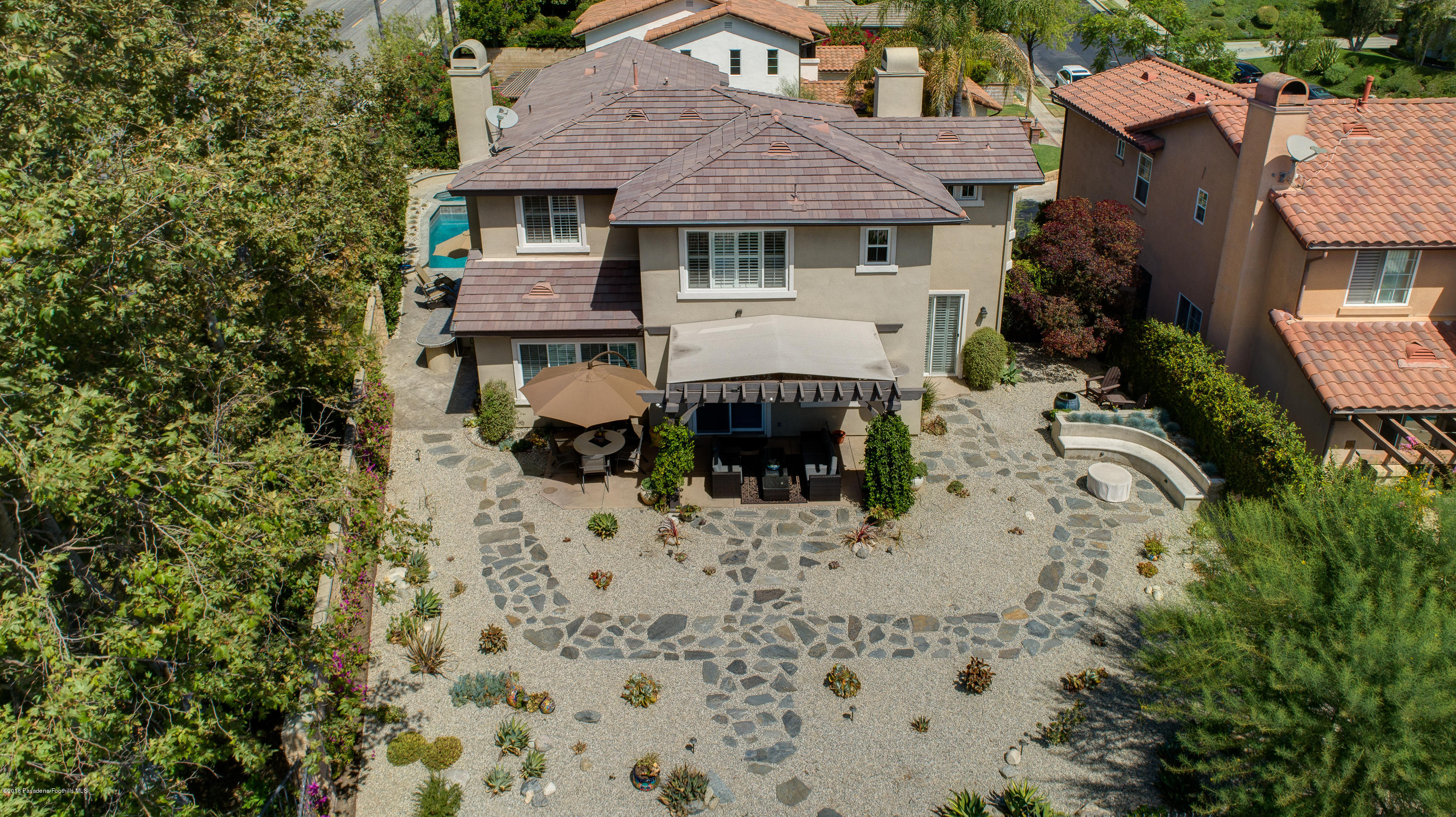 3503 Giddings Ranch Road Altadena, CA 91001 - Photo 65 of 75 a front view of a house with a yard covered with trees