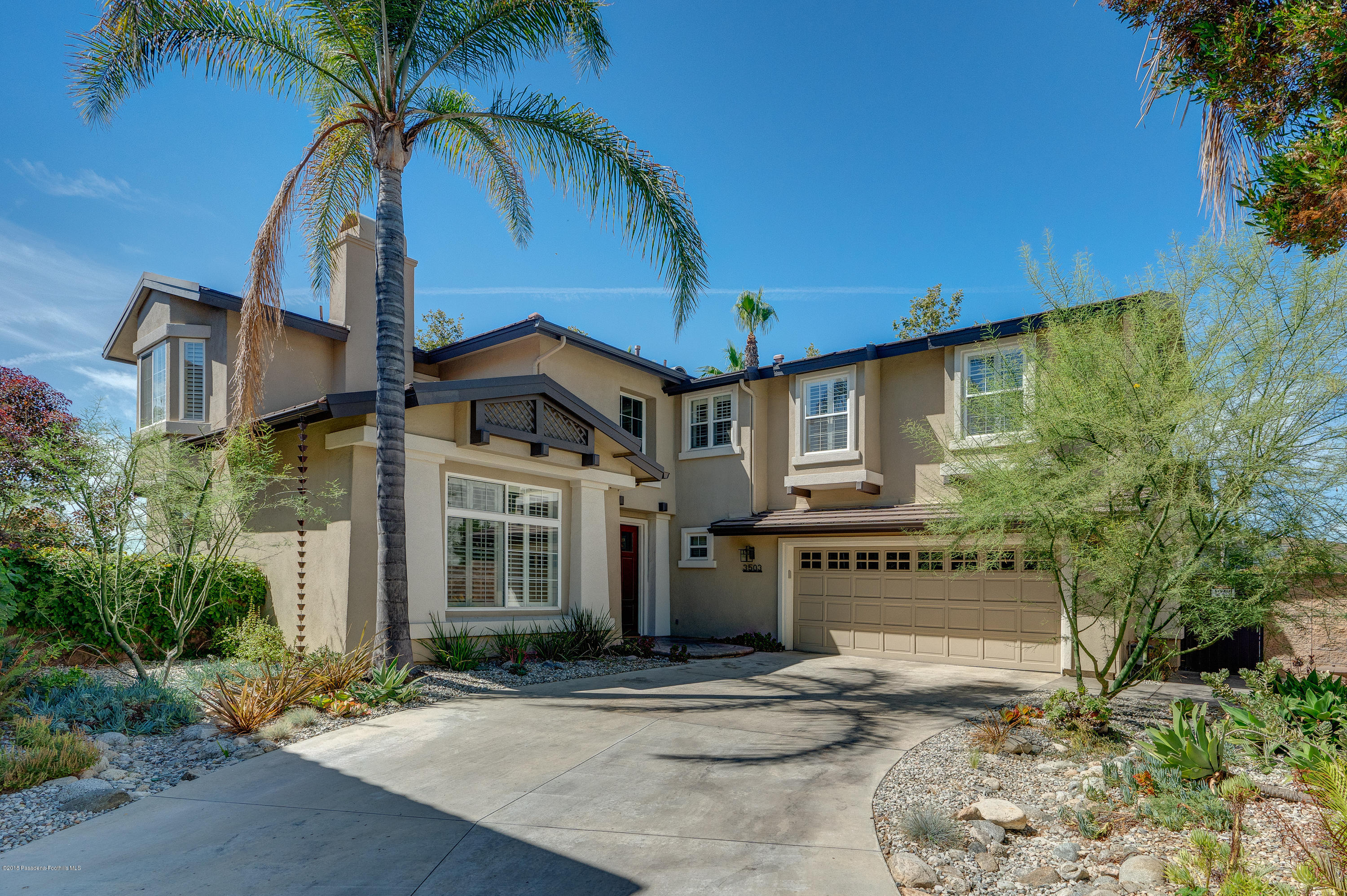 3503 Giddings Ranch Road Altadena, CA 91001 - Photo 74 of 75 a front view of a house with a yard and garage