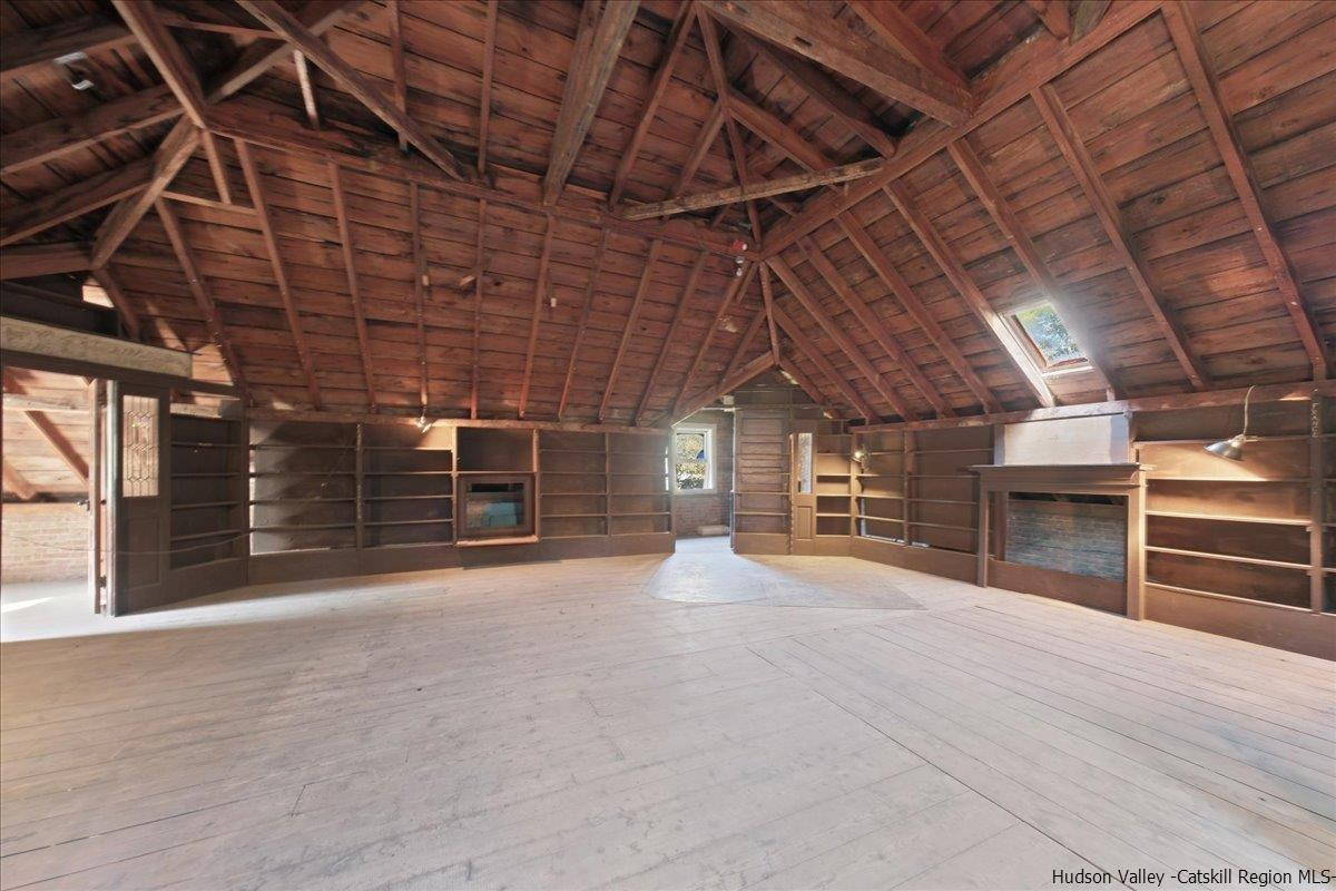 28 Maple Avenue Highland, NY 12528 - Photo 11 of 15 a view of an empty room with wooden roof and racks