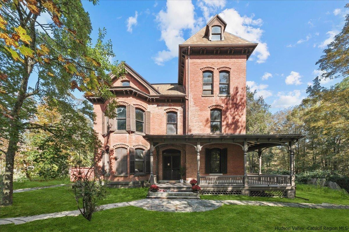 28 Maple Avenue Highland, NY 12528 - Photo 15 of 15 a front view of a house with garden and trees