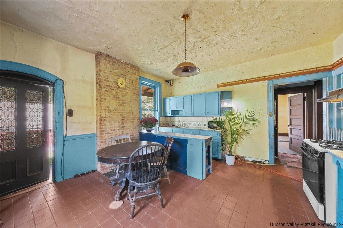 28 Maple Avenue Highland, NY 12528 - Photo 3 of 15 a view of a dining room with furniture window and wooden floor
