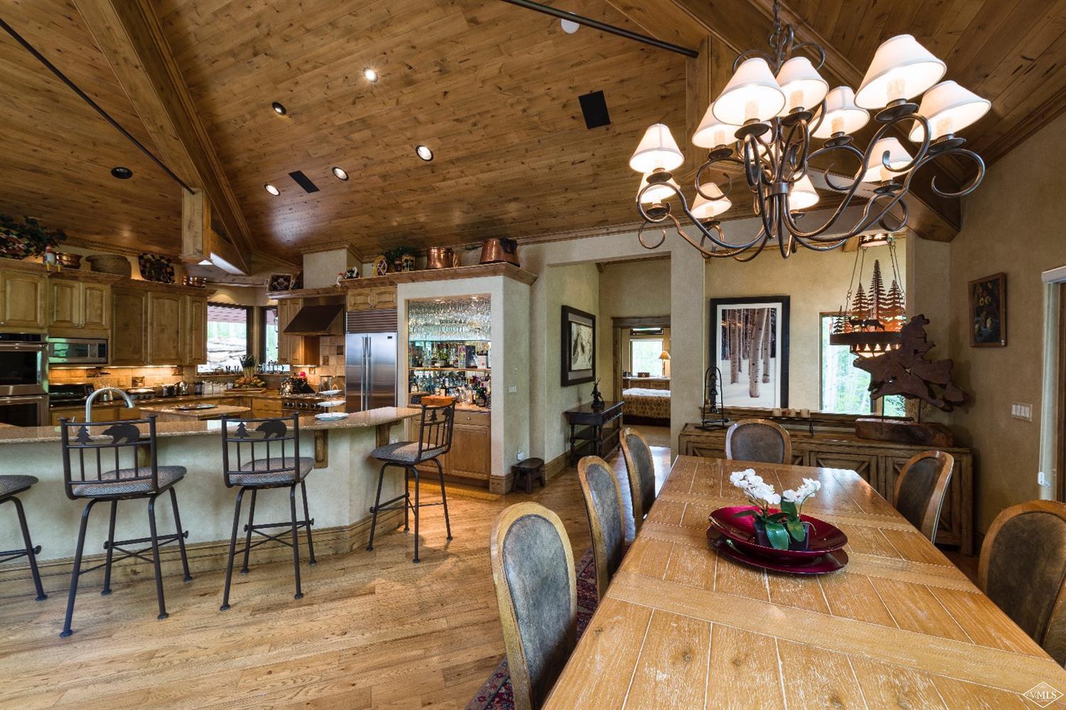 1944 Sunburst Drive, Unit A&B Vail, CO 81657 - Photo 12 of 37 a view of a dining room with furniture and chandelier