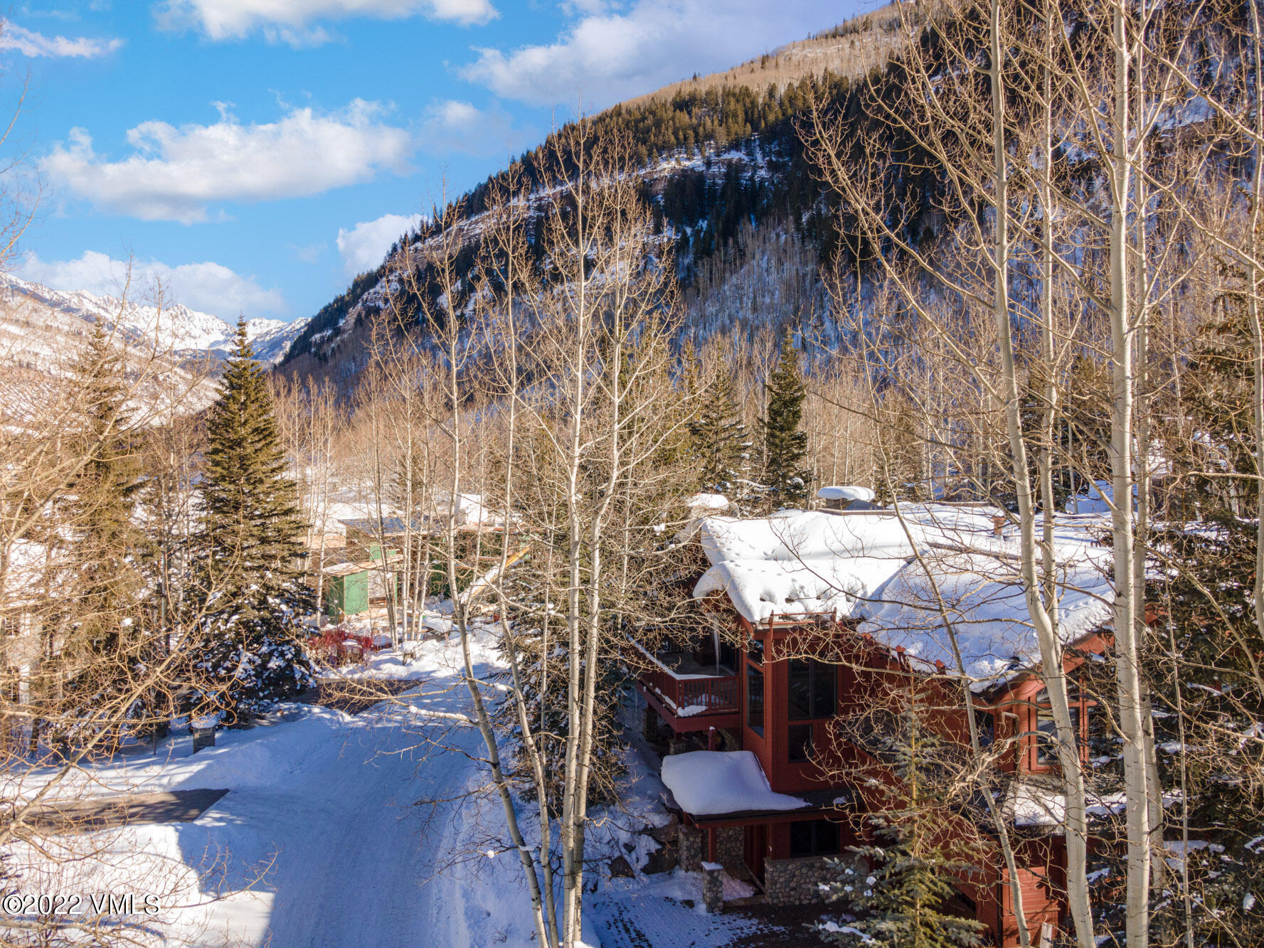 1944 Sunburst Drive, Unit A&B Vail, CO 81657 - Photo 30 of 37 a backyard of a house with table and chairs