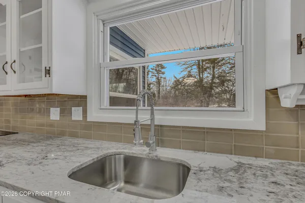 a kitchen with a sink and a window
