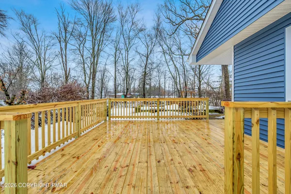 a view of swimming pool with wooden fence