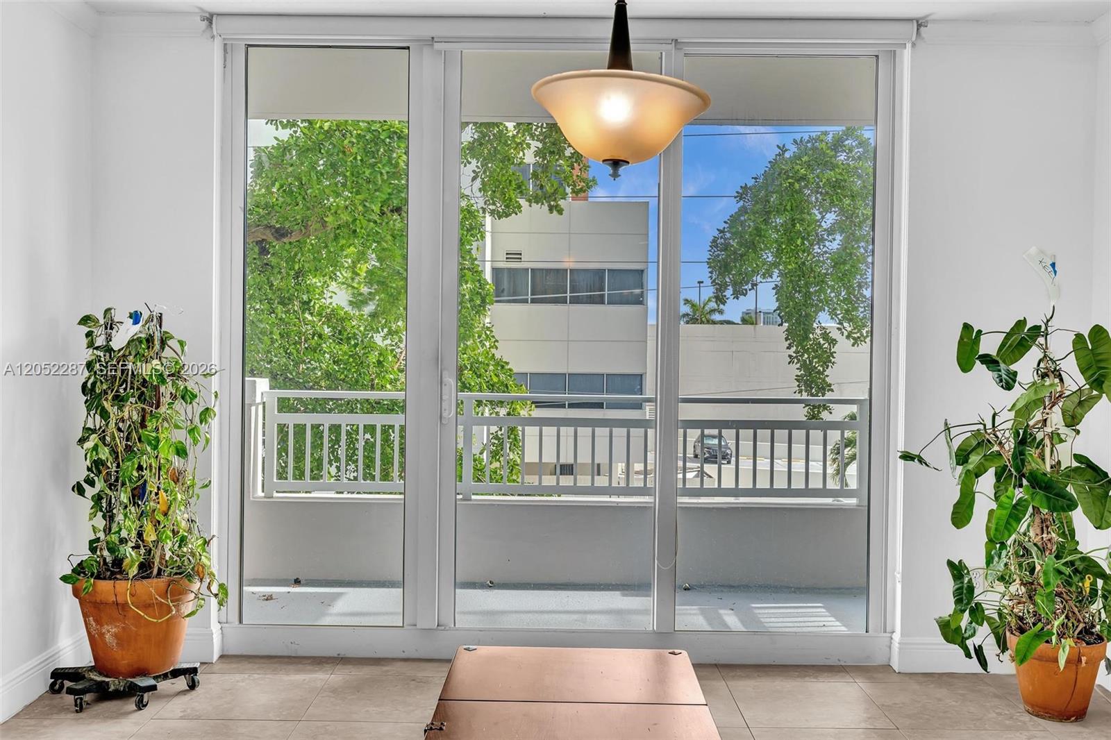 2665 Southwest 37th Avenue, Unit 313 Miami, FL 33133 - Photo 5 of 24 looking out to balcony