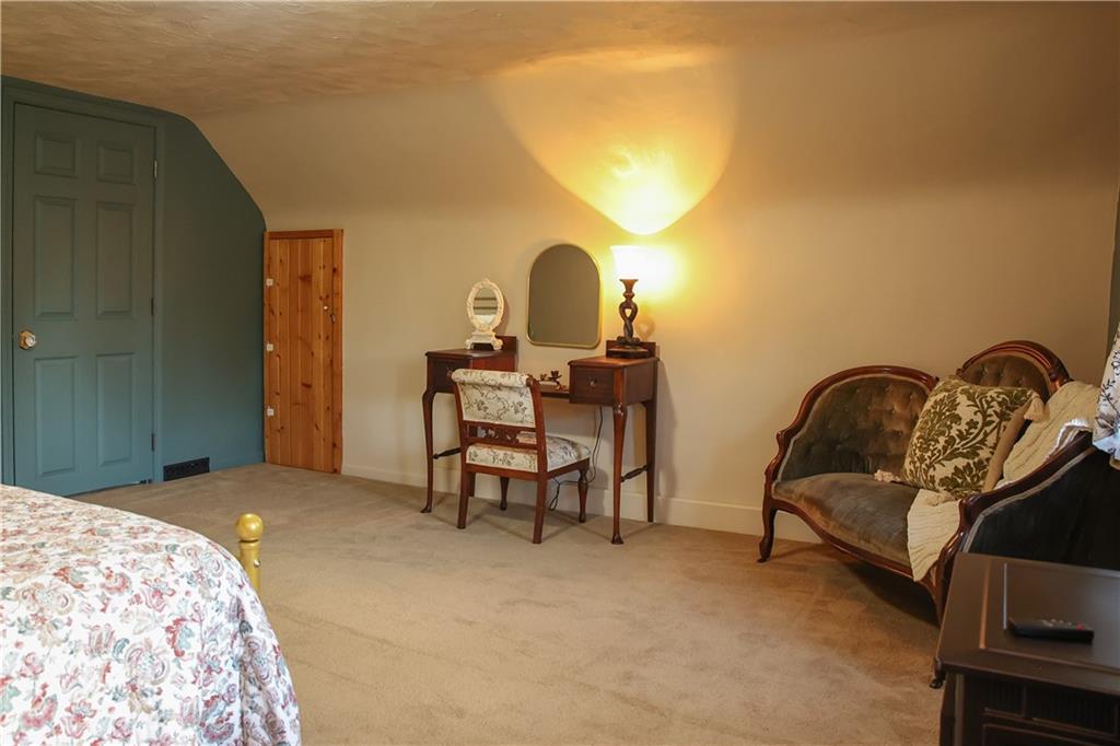 1021 Leesburg Station Road Mercer, PA 16137 - Photo 23 of 45 a bedroom with a bed and a cabinets