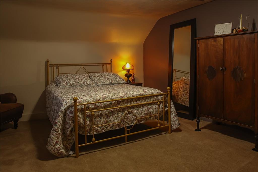 1021 Leesburg Station Road Mercer, PA 16137 - Photo 26 of 45 a bed sitting in a room next to a window