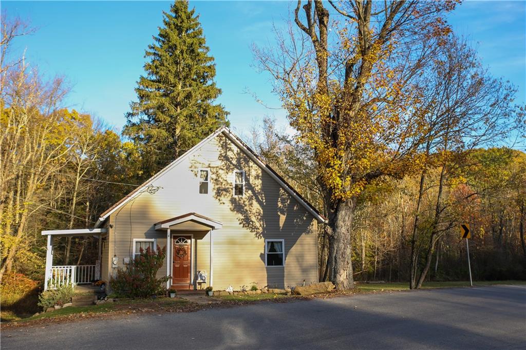 1021 Leesburg Station Road Mercer, PA 16137 - Photo 29 of 45 a front view of a house with a yard