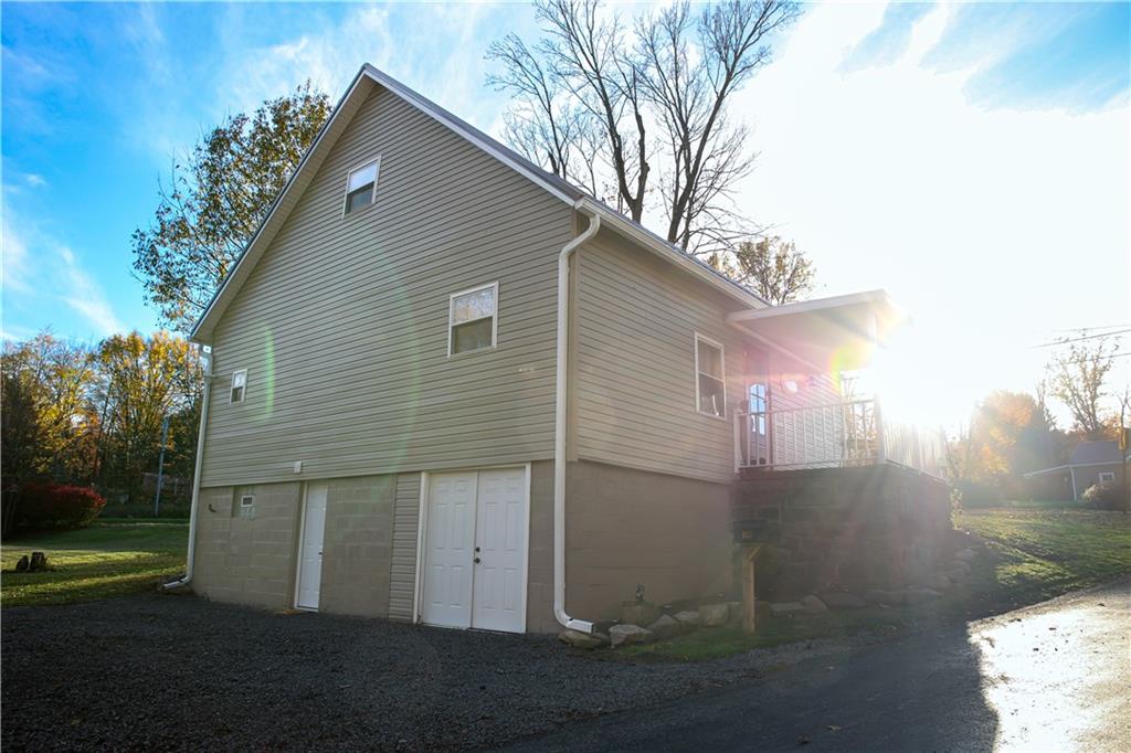1021 Leesburg Station Road Mercer, PA 16137 - Photo 30 of 45 a backyard of a house with lots of green space