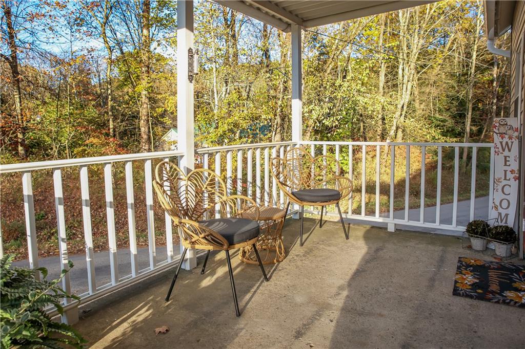 1021 Leesburg Station Road Mercer, PA 16137 - Photo 3 of 45 a view of a chairs and table in the back yard of a house