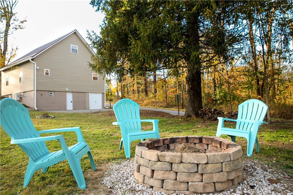 1021 Leesburg Station Road Mercer, PA 16137 - Photo 31 of 45 a view of a chair and table in the backyard