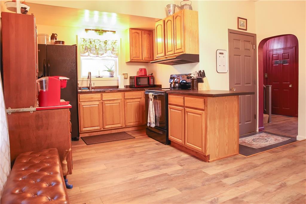 1021 Leesburg Station Road Mercer, PA 16137 - Photo 6 of 45 a kitchen with stainless steel appliances granite countertop a refrigerator and a stove