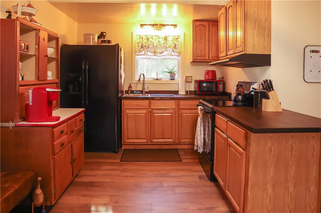 1021 Leesburg Station Road Mercer, PA 16137 - Photo 7 of 45 a kitchen with stainless steel appliances granite countertop a refrigerator a stove a sink and dishwasher
